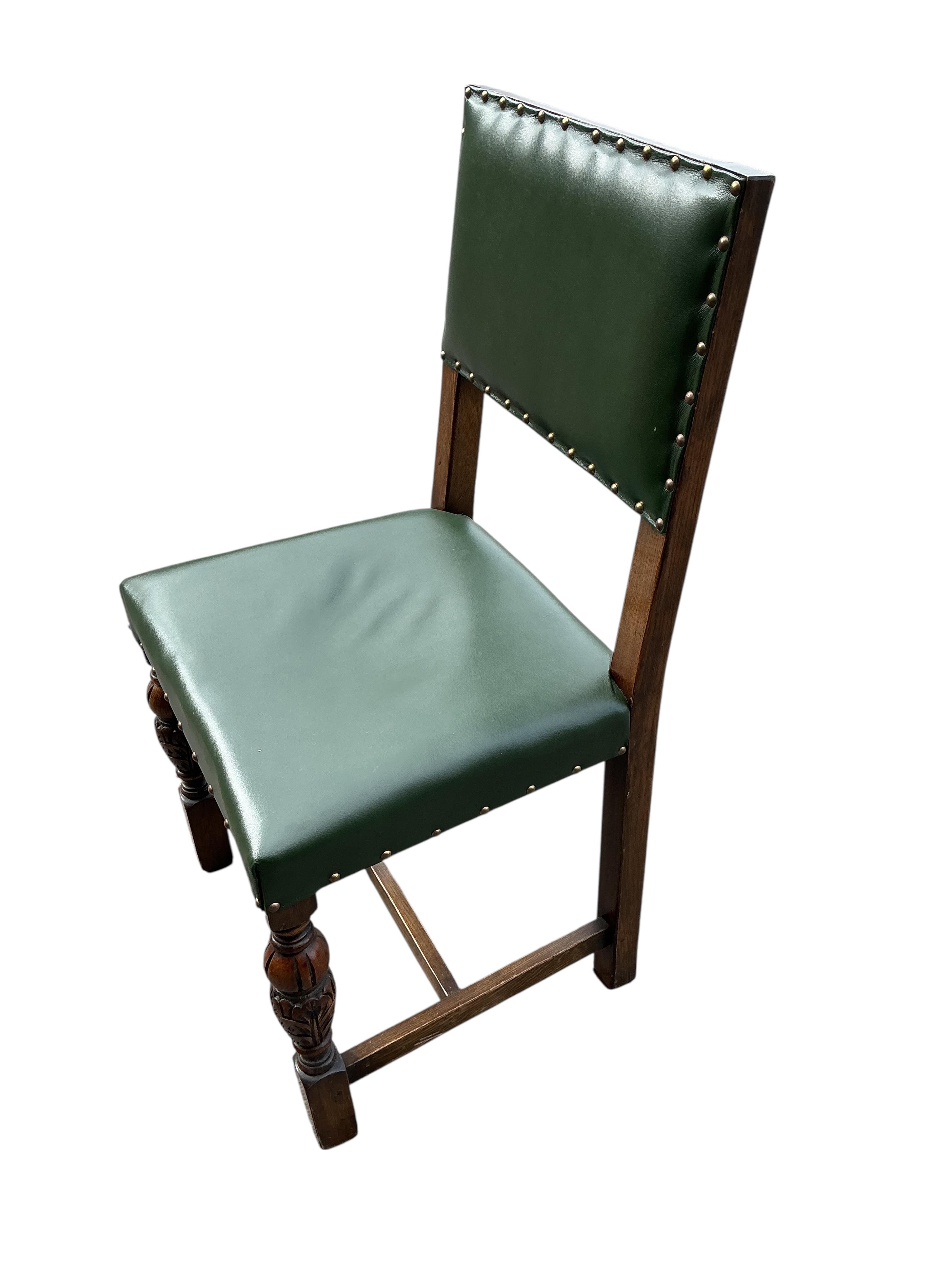 A set of twelve Bevan Funnel oak dining chairs, two with arms